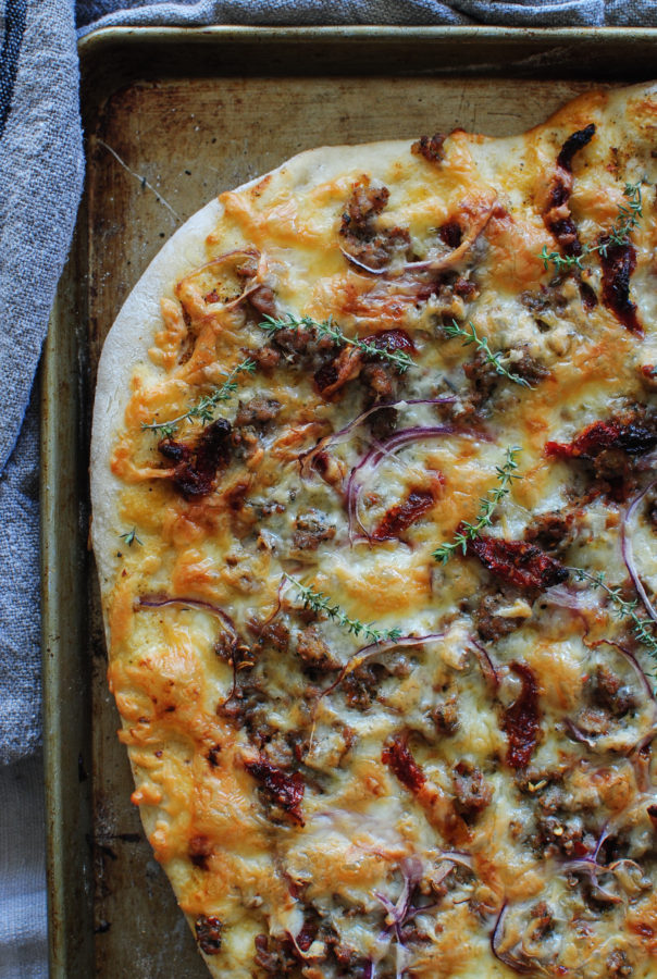 Sun Dried Tomato Pizza with Sausage and Roasted Garlic / Bev Cooks