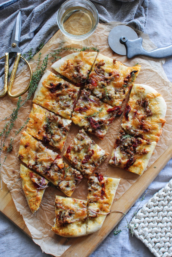 Sun Dried Tomato Pizza with Sausage and Roasted Garlic / Bev Cooks