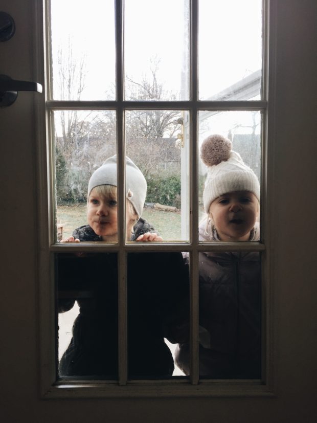 Toddlers in Winter Window