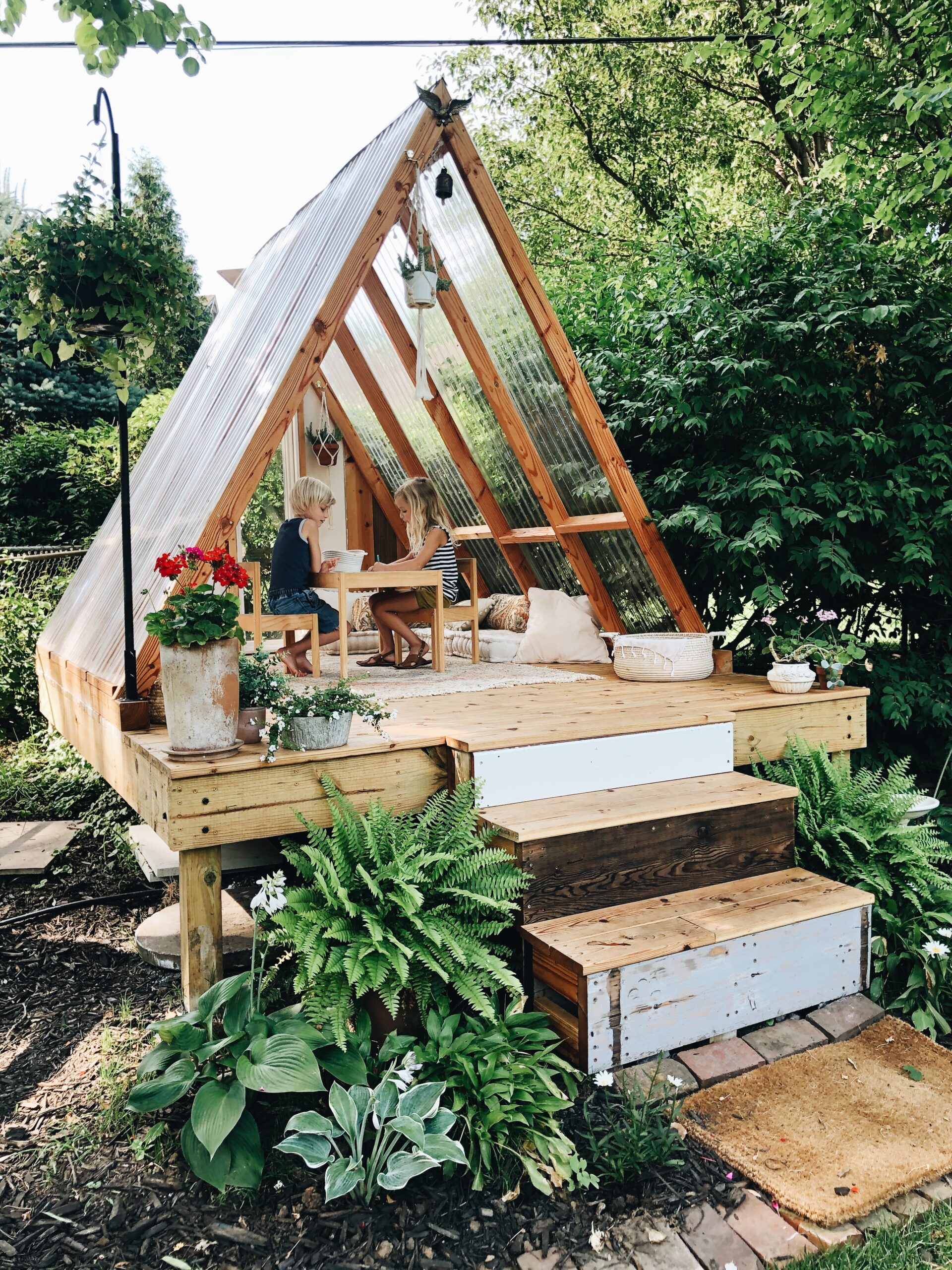 a frame outdoor playhouse